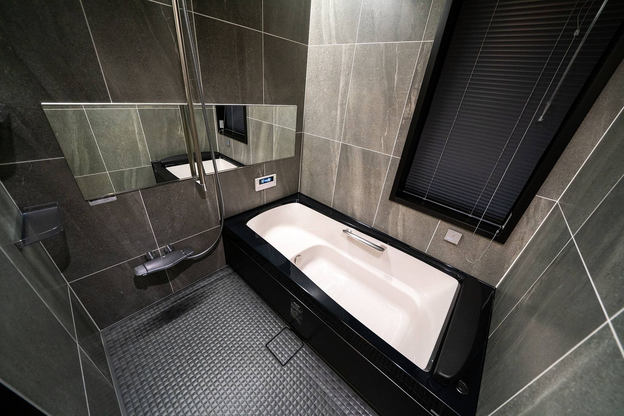 Modern bathroom with a deep bath and separate shower area