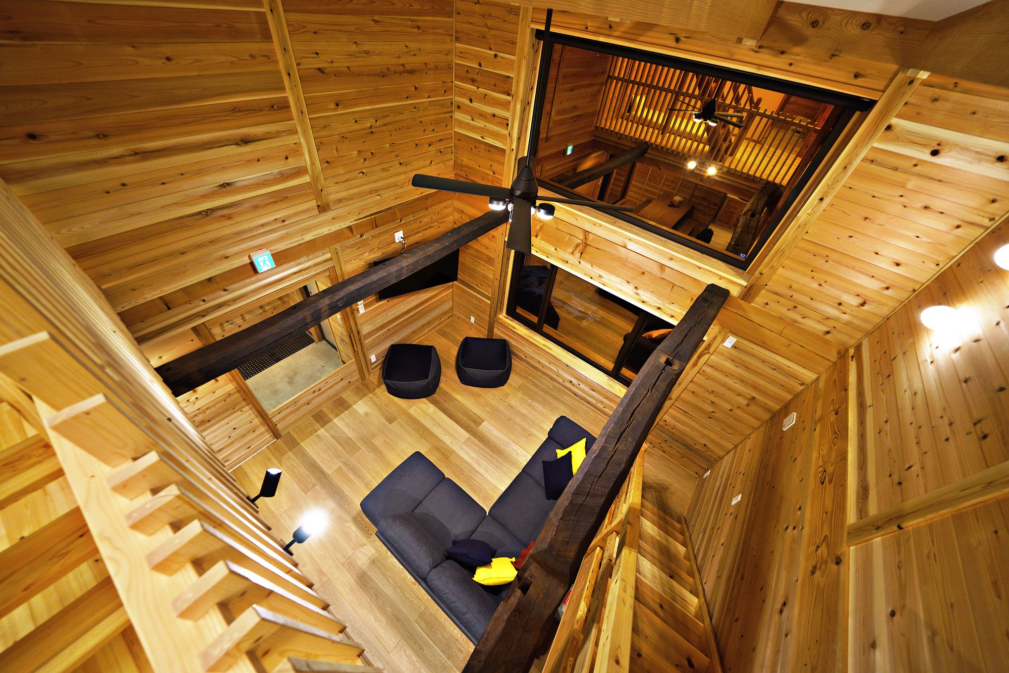 Looking down into the living room from the loft